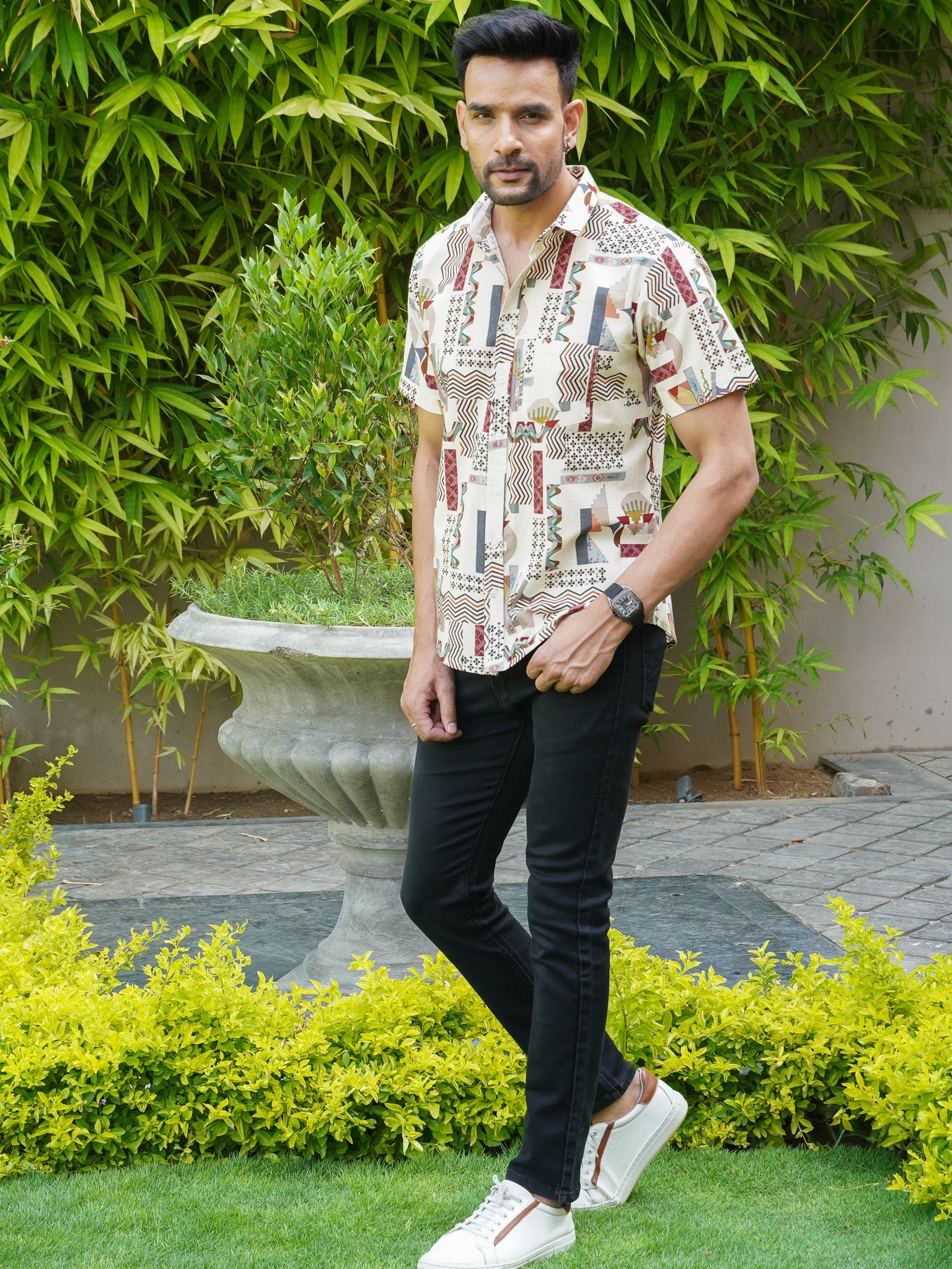 Model wearing men’s beige abstract geometric print half sleeve shirt