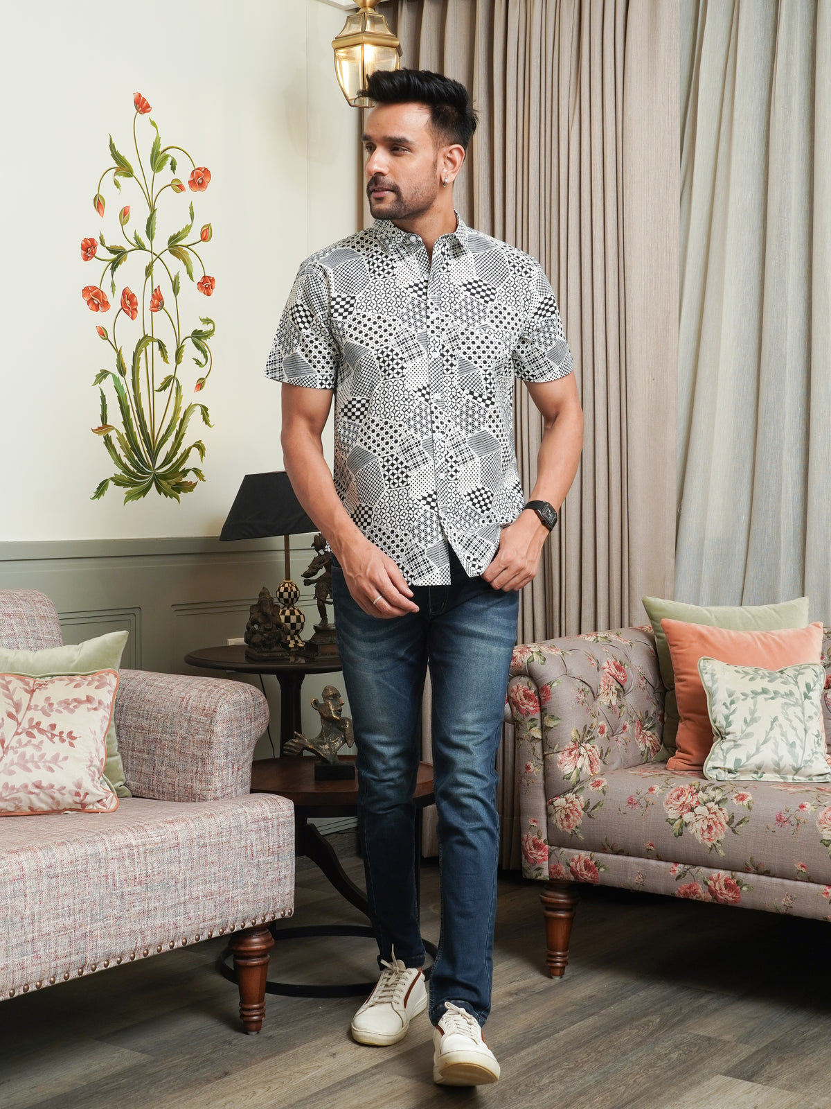 Model wearing a black abstract geometric printed cotton half sleeve shirt
