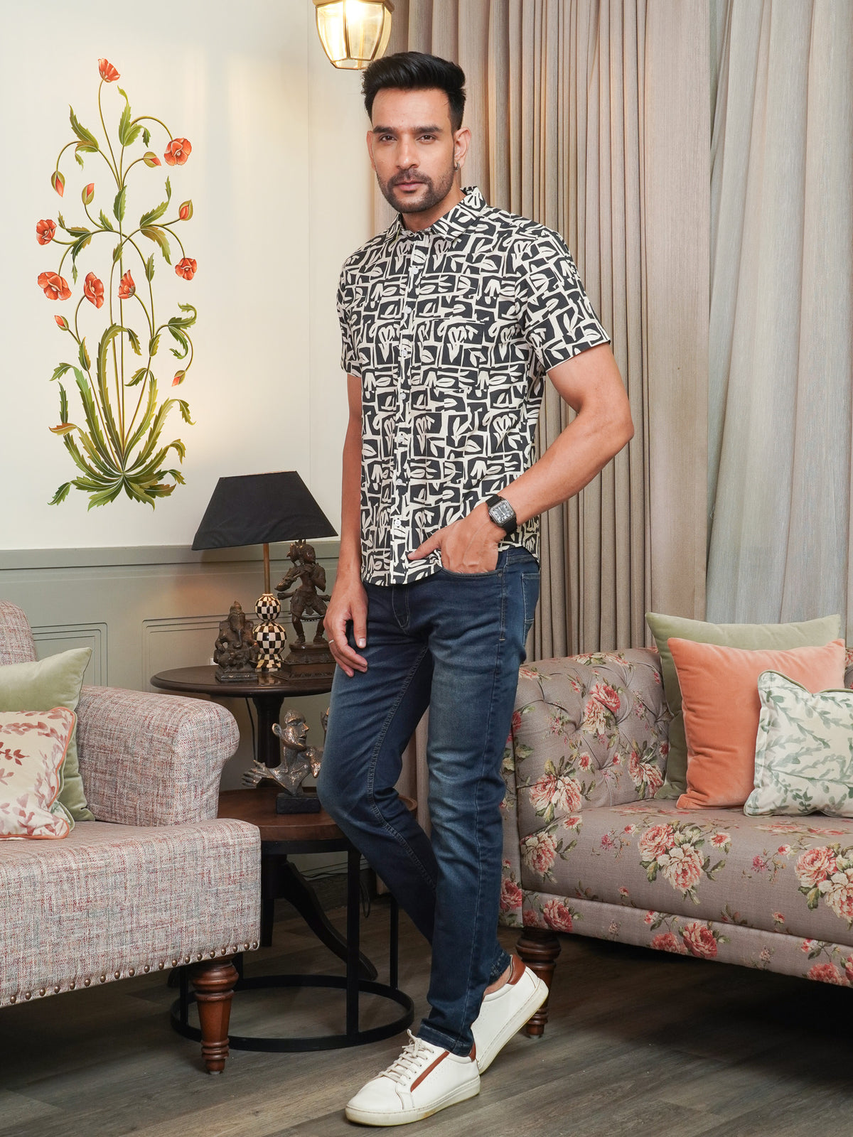Model wearing a black geometric abstract printed cotton shirt