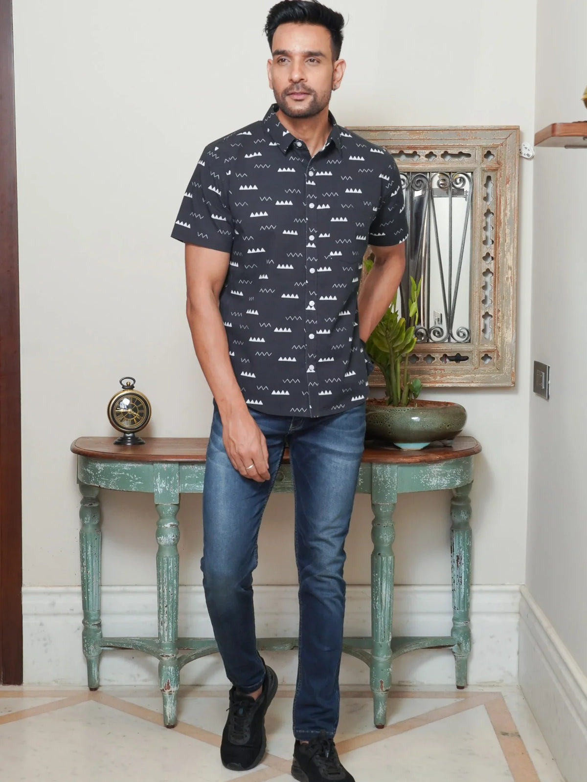Front view of men’s black geometric printed cotton shirt