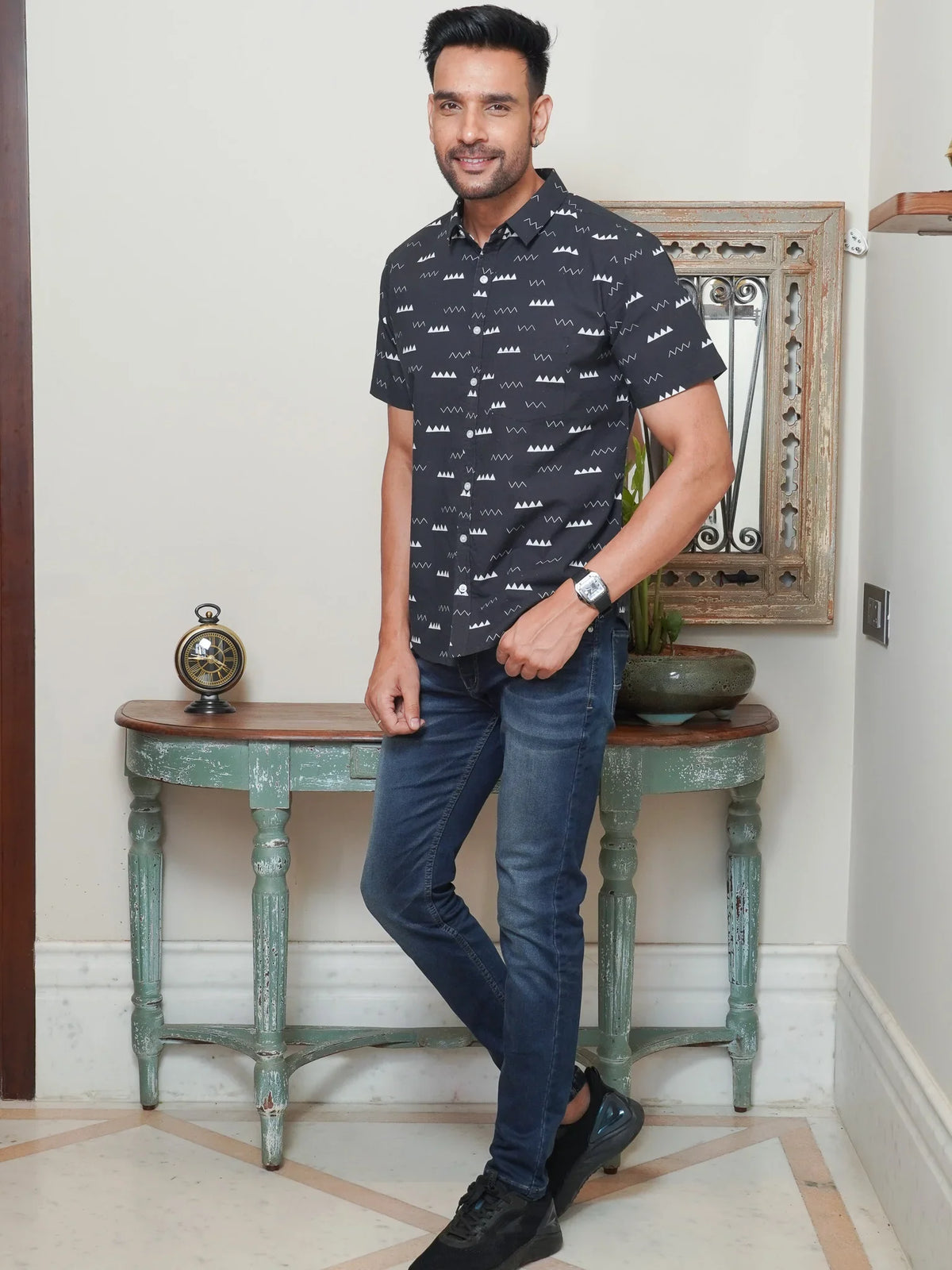 Model wearing a black minimal geometric printed cotton shirt