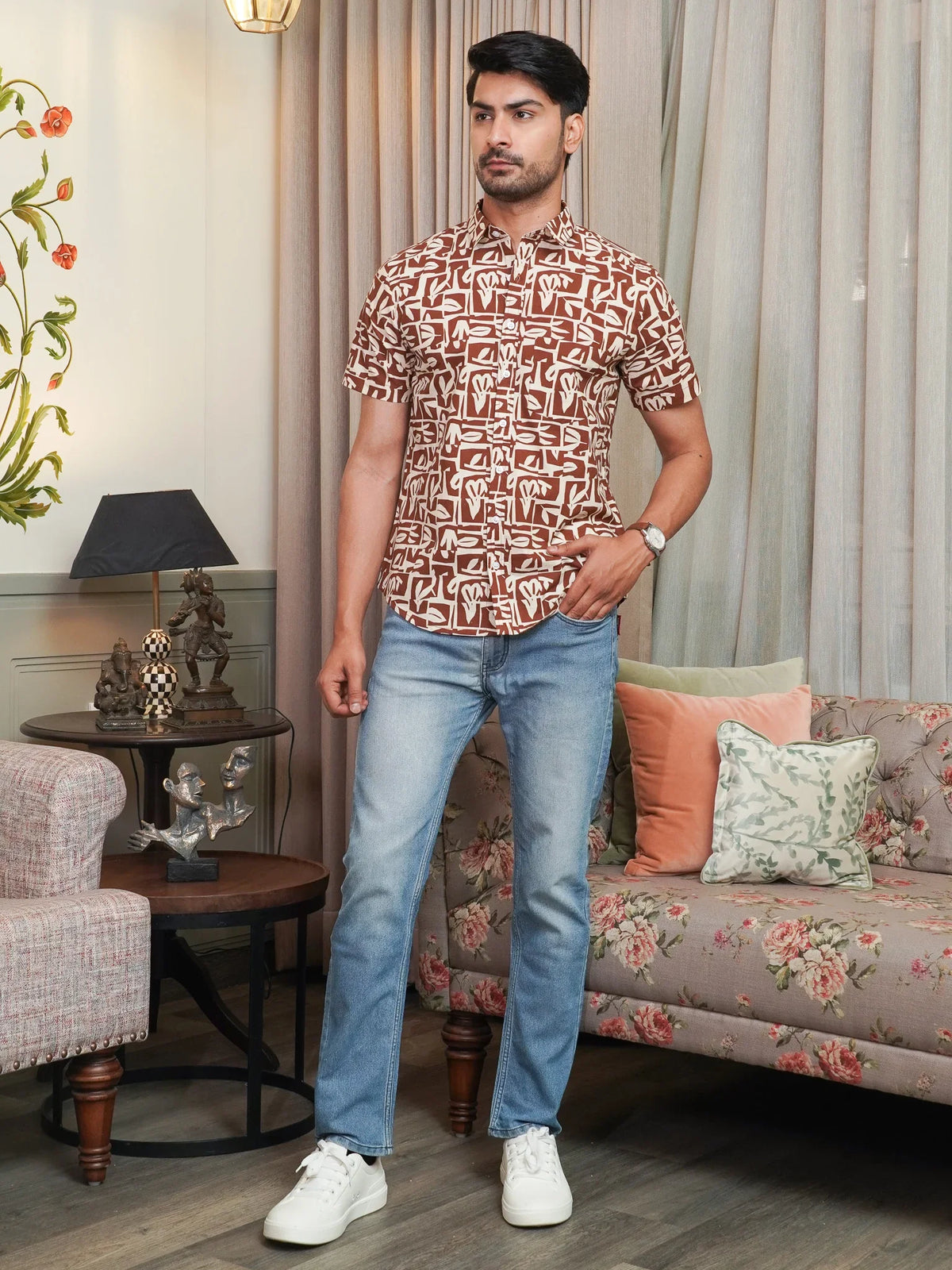 Button-front detail on men’s brown printed cotton shirt