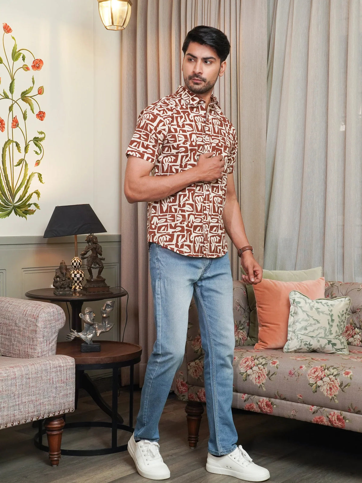 Half sleeve with cream abstract motifs on brown fabric