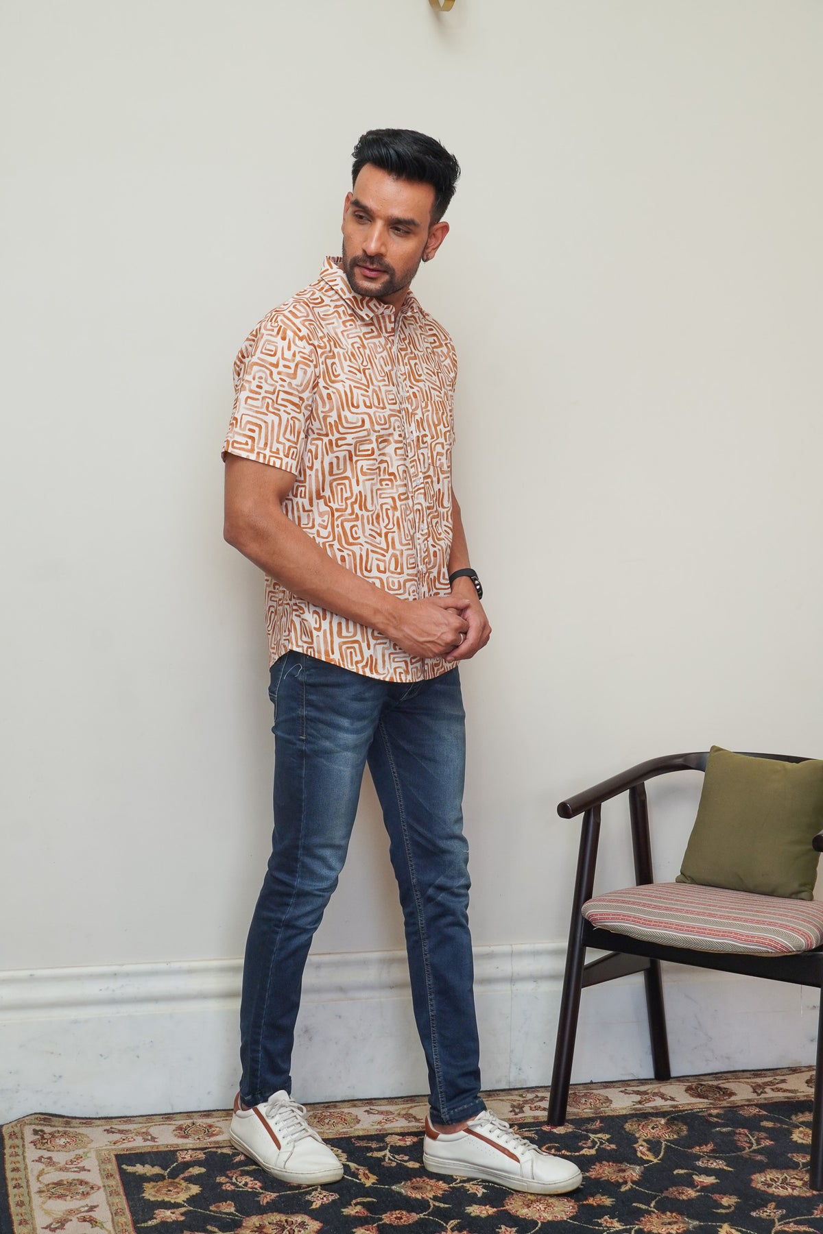 Model wearing men’s cream orange abstract box print half sleeve shirt