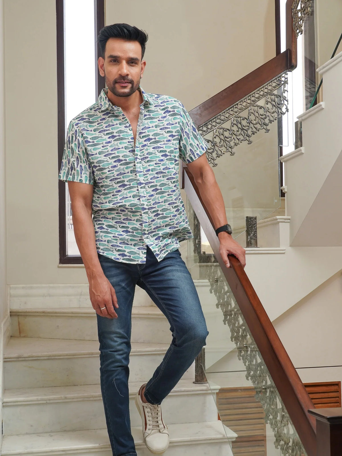 Front view of men’s green fish printed cotton shirt
