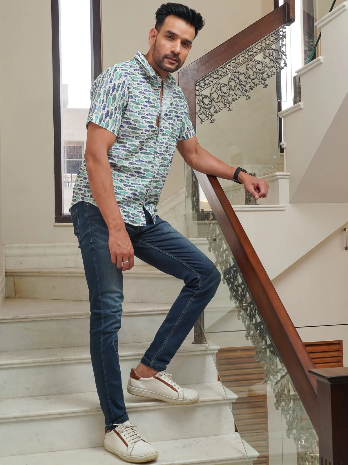 Front view of men’s green fish printed cotton shirt
