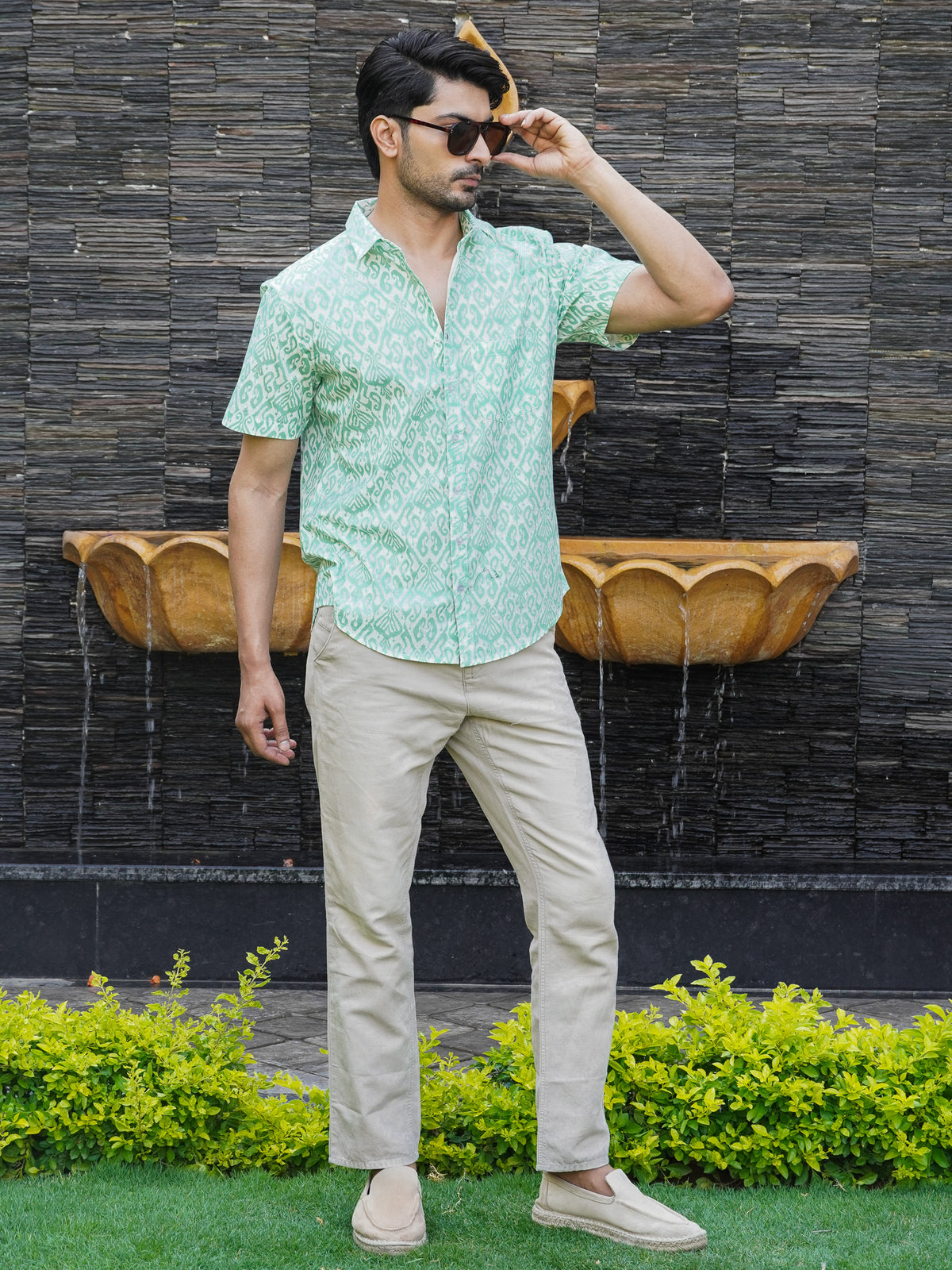 Front view of men’s green geometric printed cotton shirt