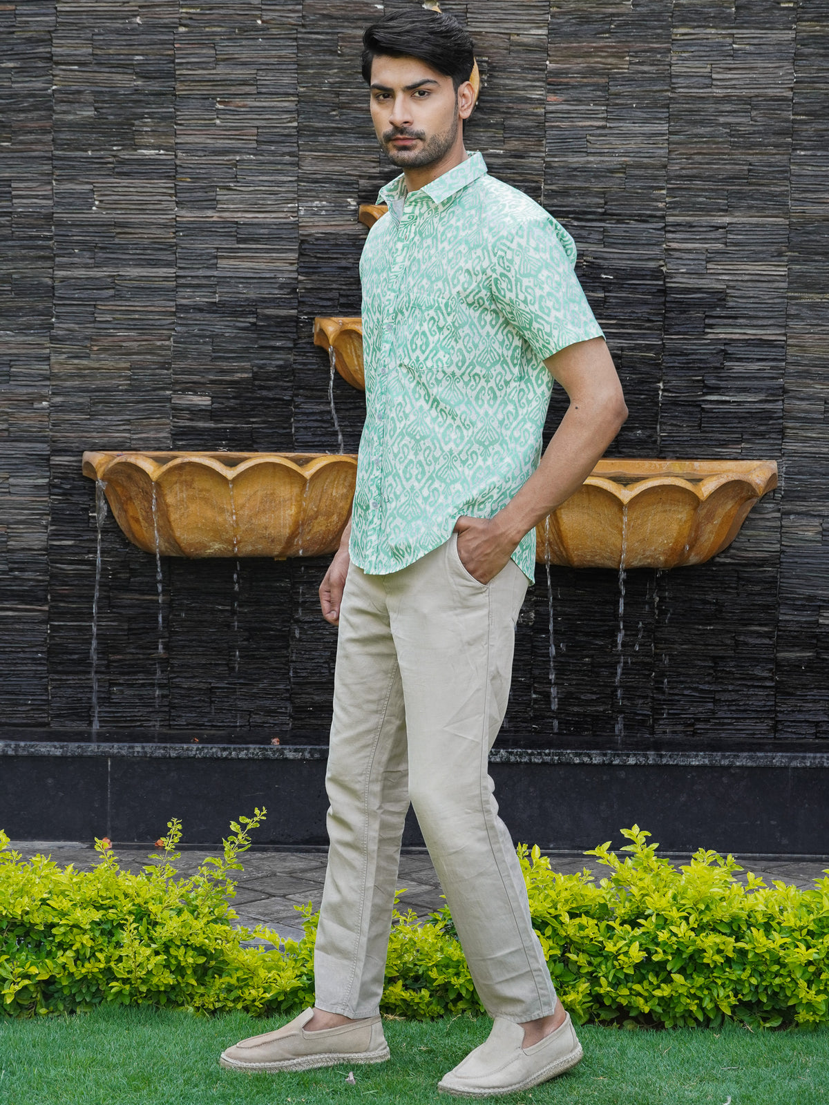 Front view of men’s green geometric printed cotton shirt