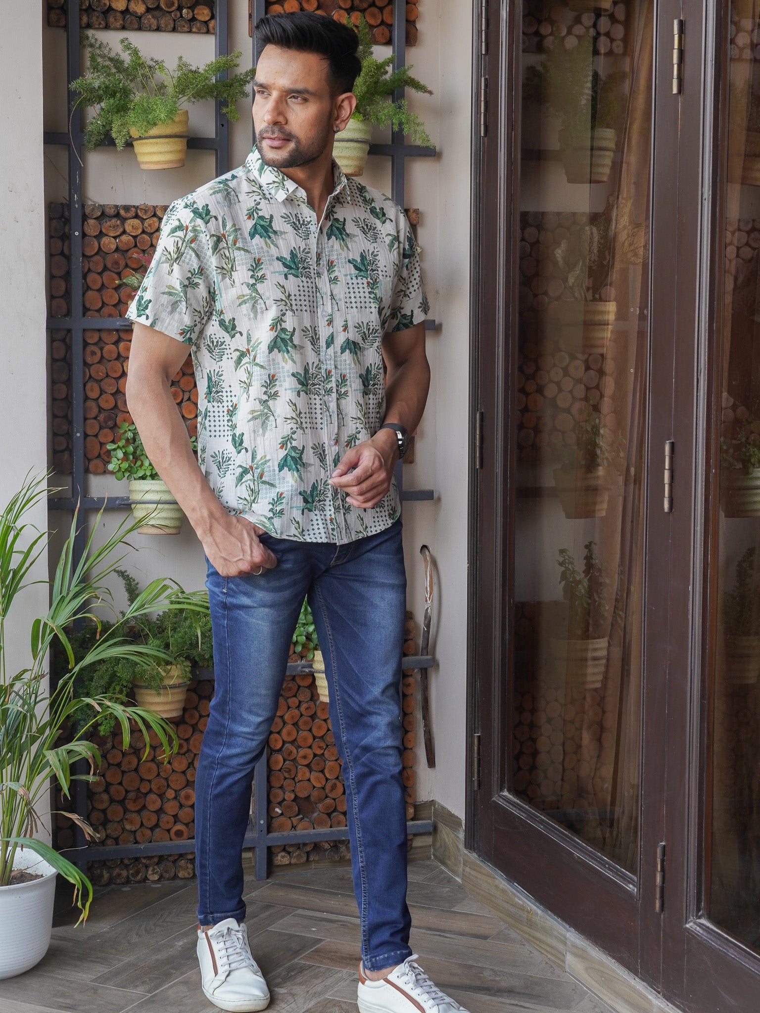 Close-up of leaf and lattice pattern on light green cotton shirt