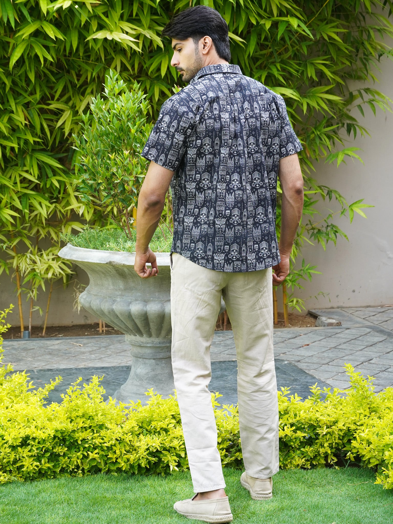 Back view of men’s black tribal art print regular fit shirt