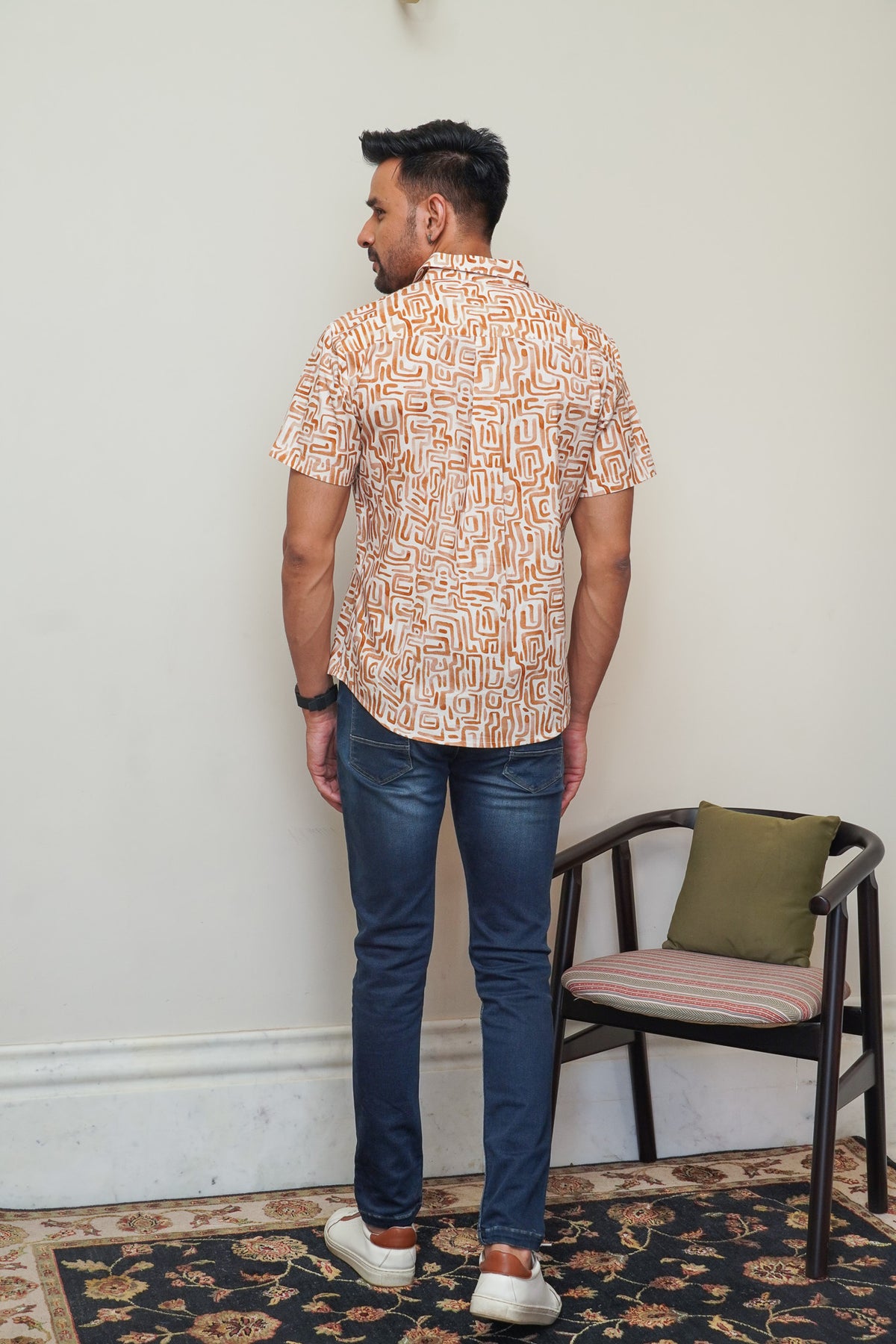 Back view of men’s cream orange abstract print regular fit shirt