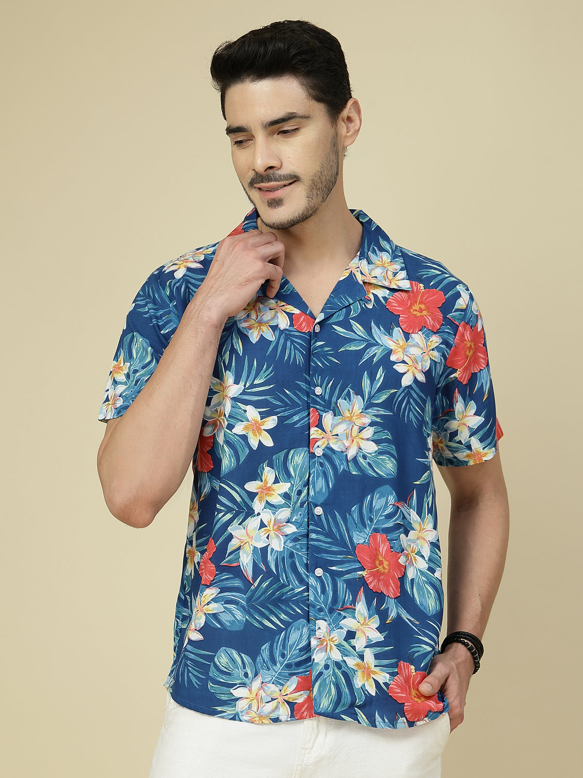 Model wearing a blue tropical floral cotton half sleeve shirt