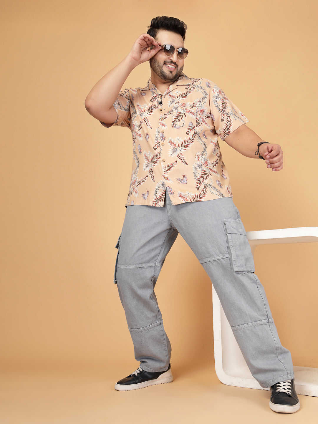 Plus-size man wearing a beige tropical rayon twill shirt
