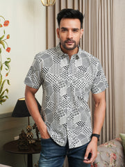 Model wearing a black abstract geometric printed cotton half sleeve shirt