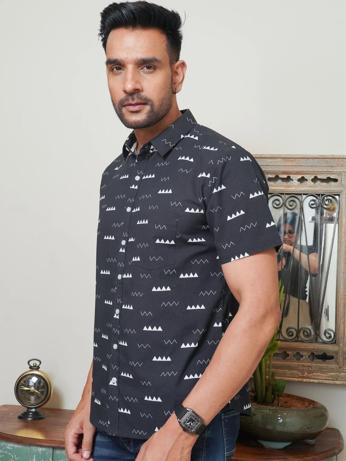 Model wearing a black minimal geometric printed cotton shirt
