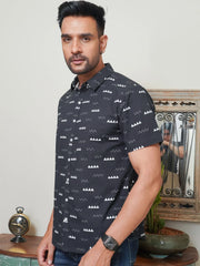 Model wearing a black minimal geometric printed cotton shirt