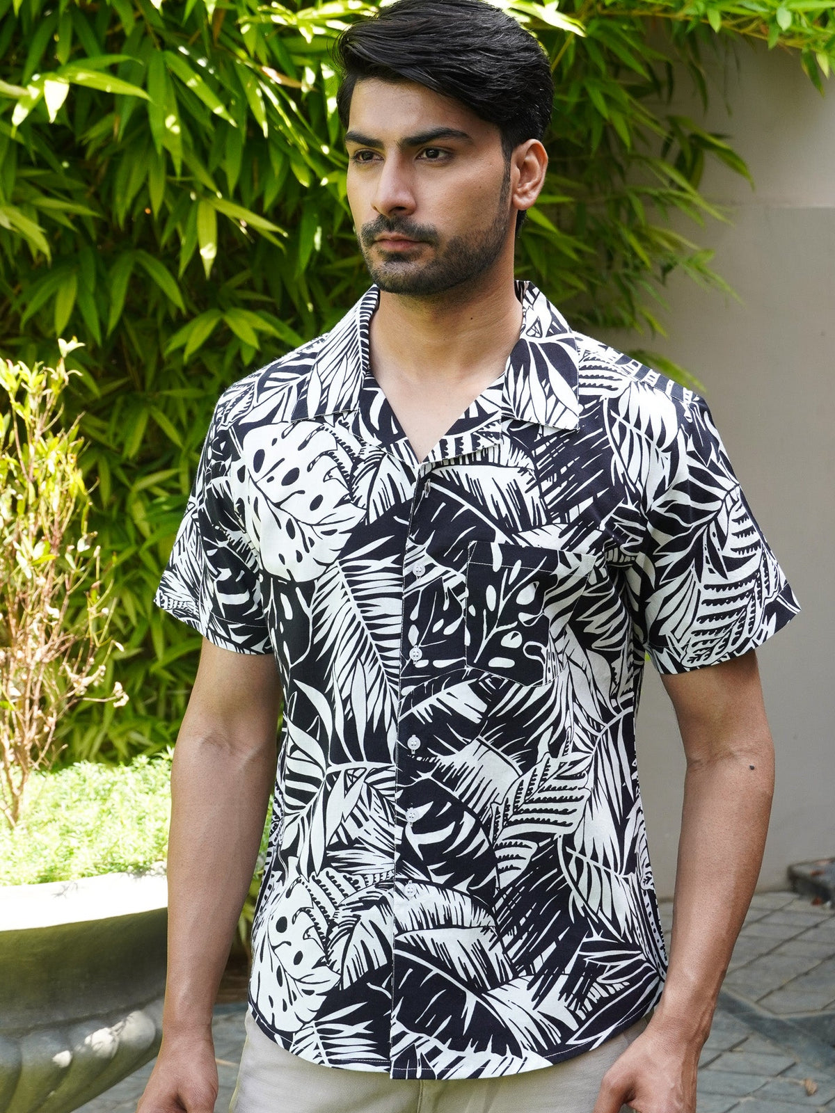 Side view of black and white botanical leaf half sleeve shirt for men