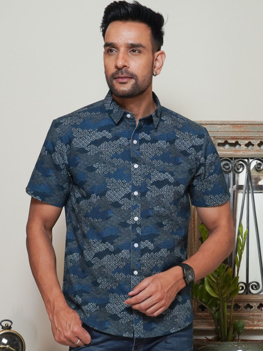 Model wearing a dark blue Cloudywash abstract printed half sleeve shirt