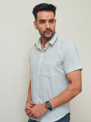 Model wearing a blue floral printed pure cotton half sleeve shirt