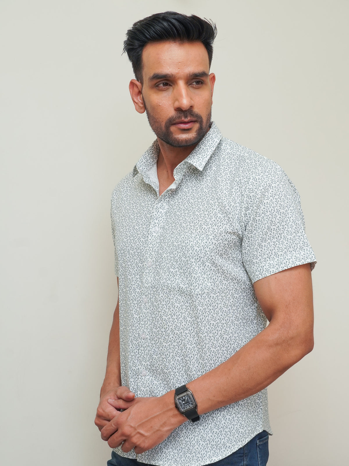 Model wearing a blue floral printed pure cotton half sleeve shirt