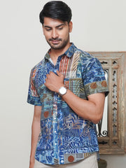 Model wearing a blue geometric abstract printed cotton half sleeve shirt