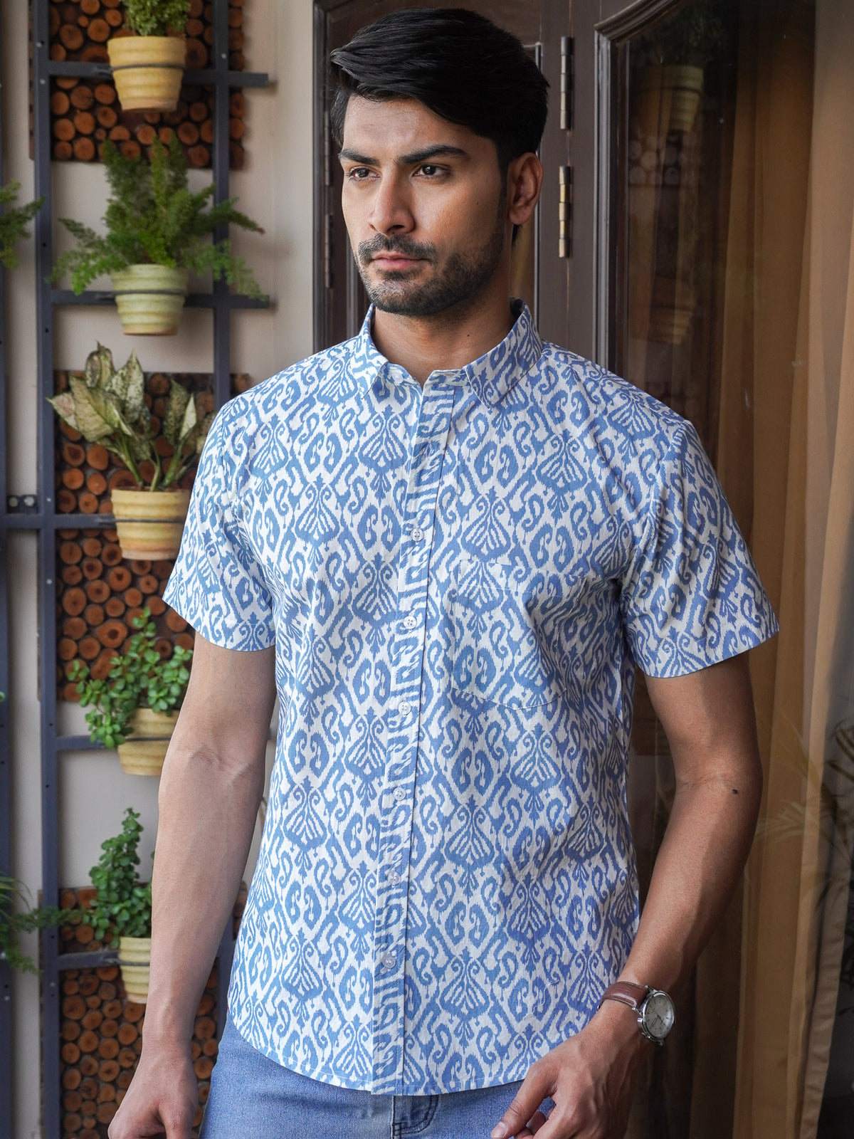 Model wearing a blue indigo printed cotton half sleeve shirt