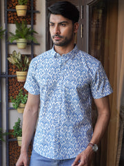 Model wearing a blue indigo printed cotton half sleeve shirt