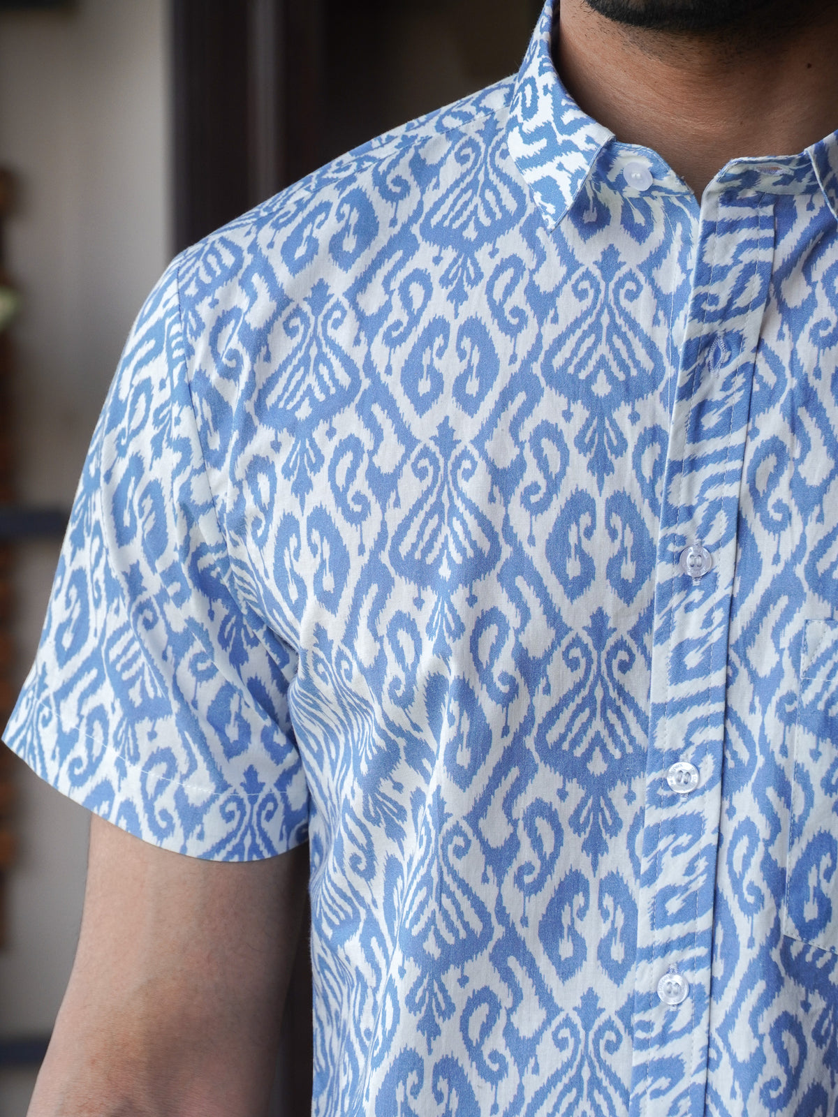 Side view of men’s blue indigo half sleeve shirt