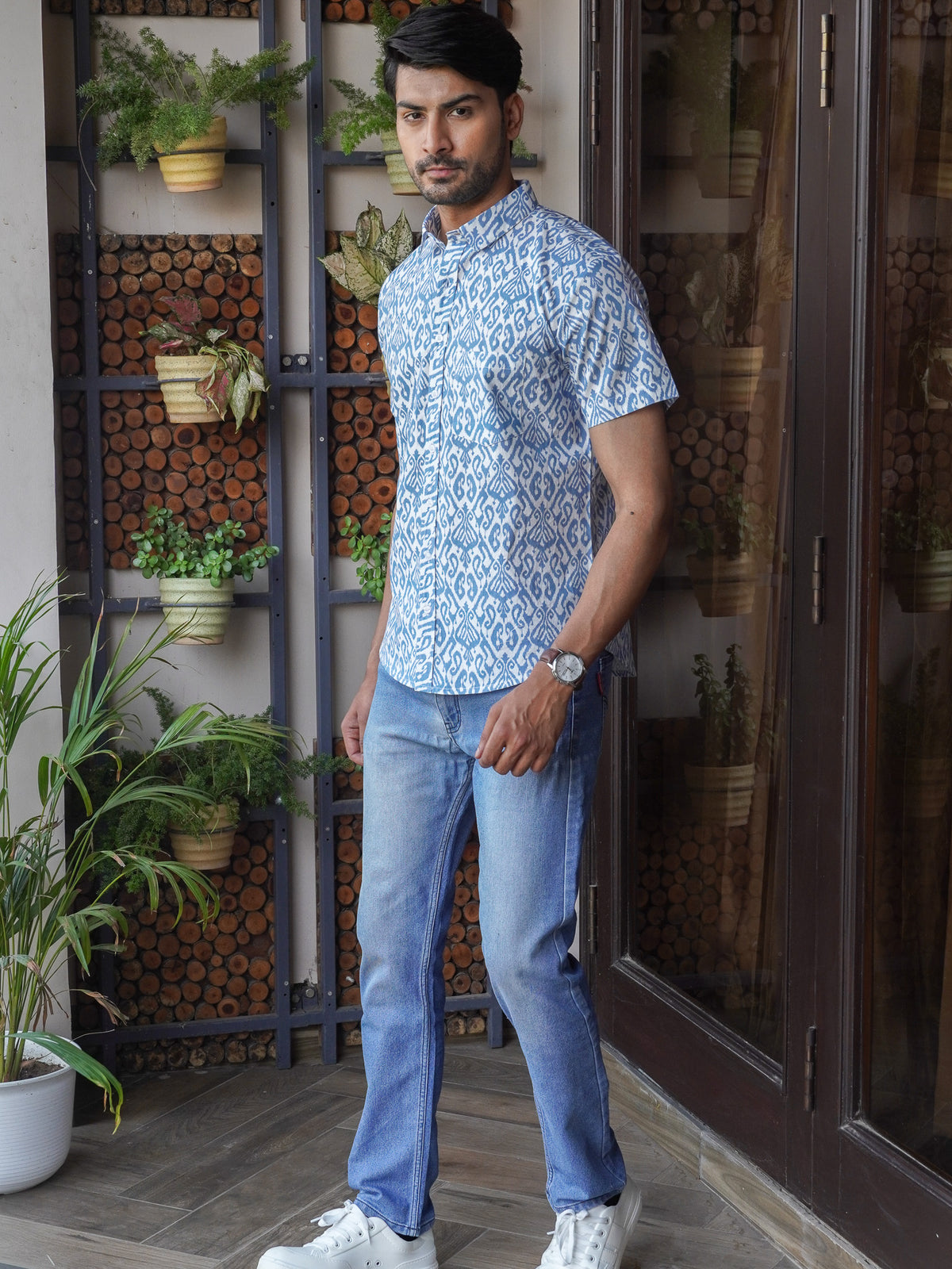 Model wearing a blue indigo printed cotton half sleeve shirt