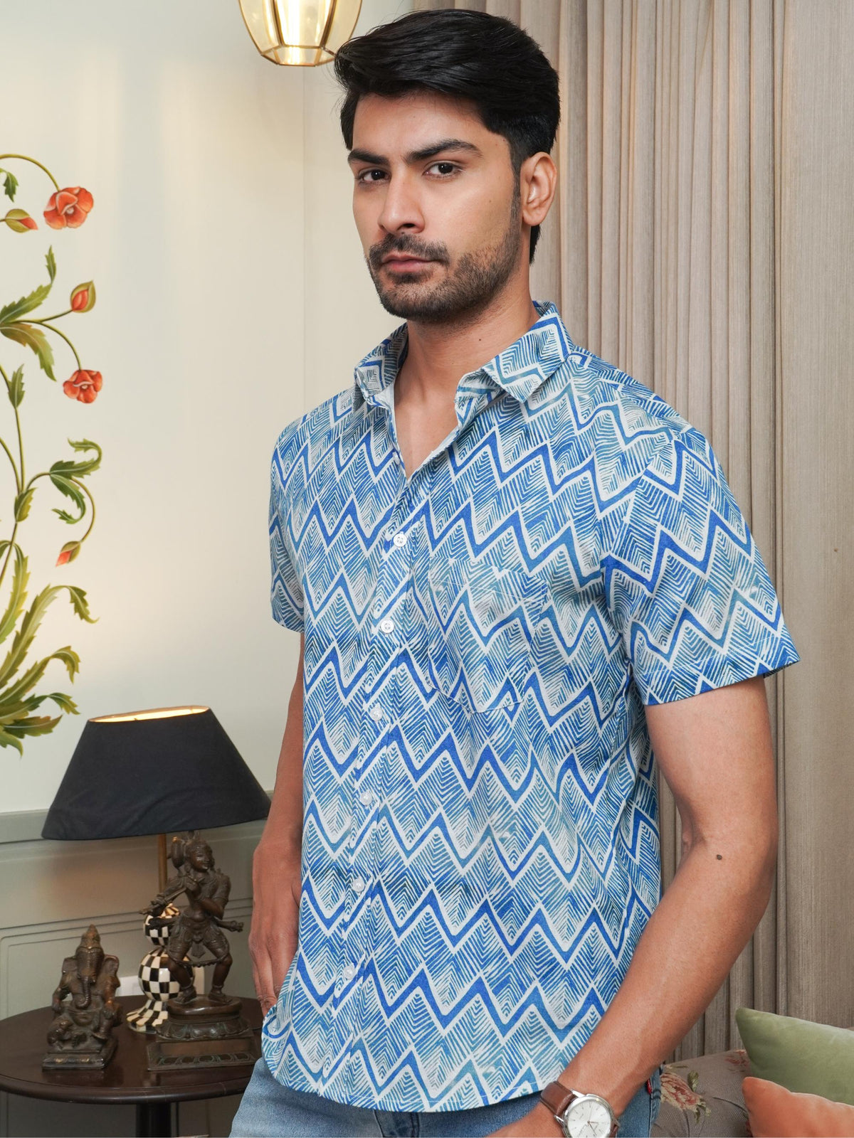 Model wearing a blue zigzag printed pure cotton half sleeve shirt