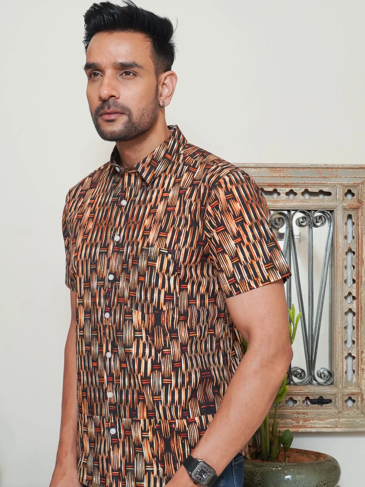 Model wearing a brown abstract geometric printed cotton half sleeve shirt