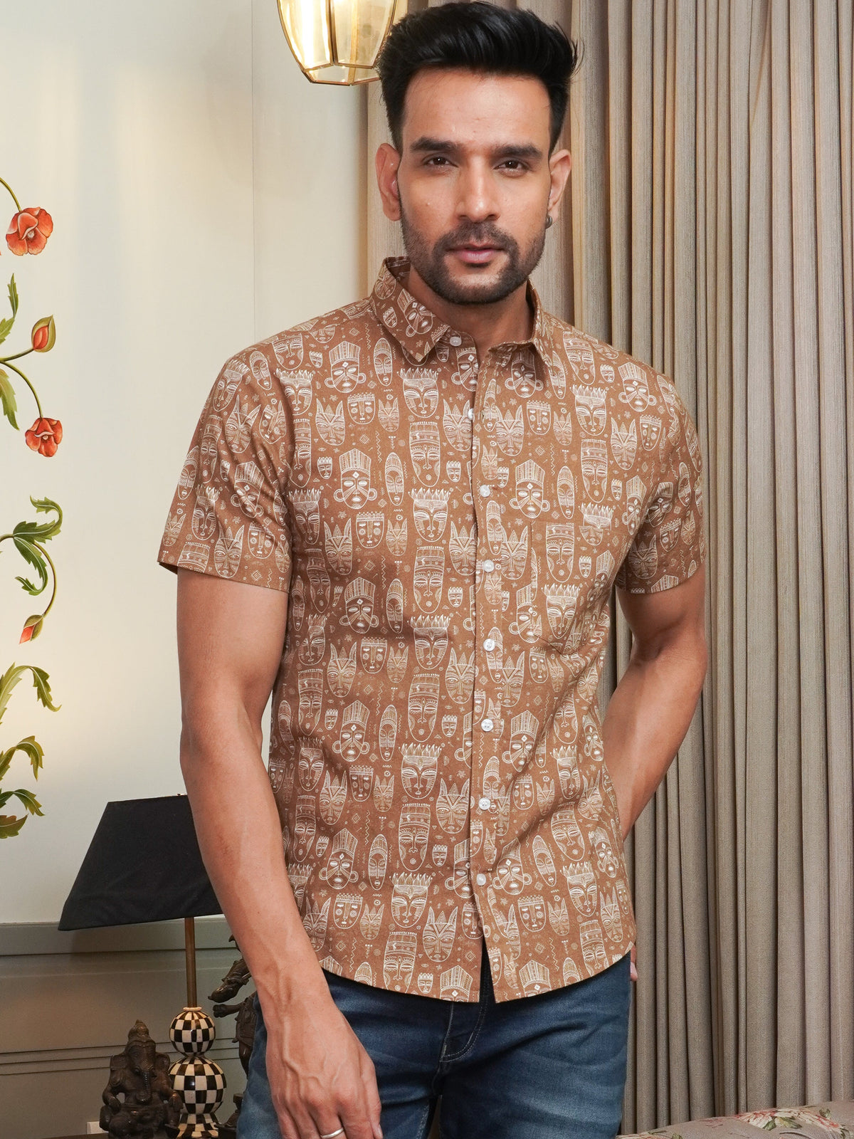 Model wearing a brown artistic printed cotton half sleeve shirt