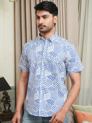 Model wearing a blue abstract geometric printed cotton half sleeve shirt