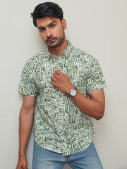 Model wearing a green abstract maze printed cotton half sleeve shirt