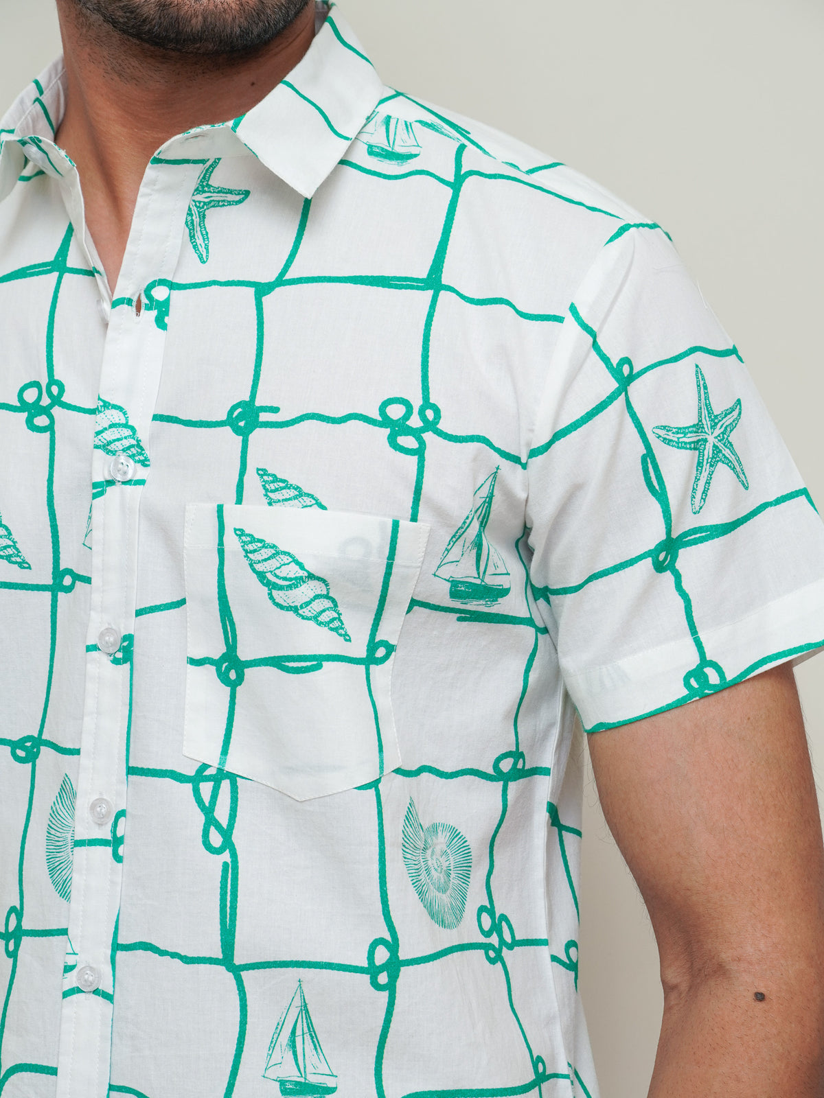 Side view of men’s green abstract half sleeve shirt