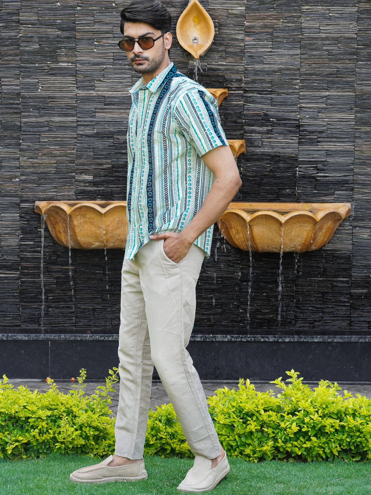 Side view of men’s light green half sleeve printed shirt