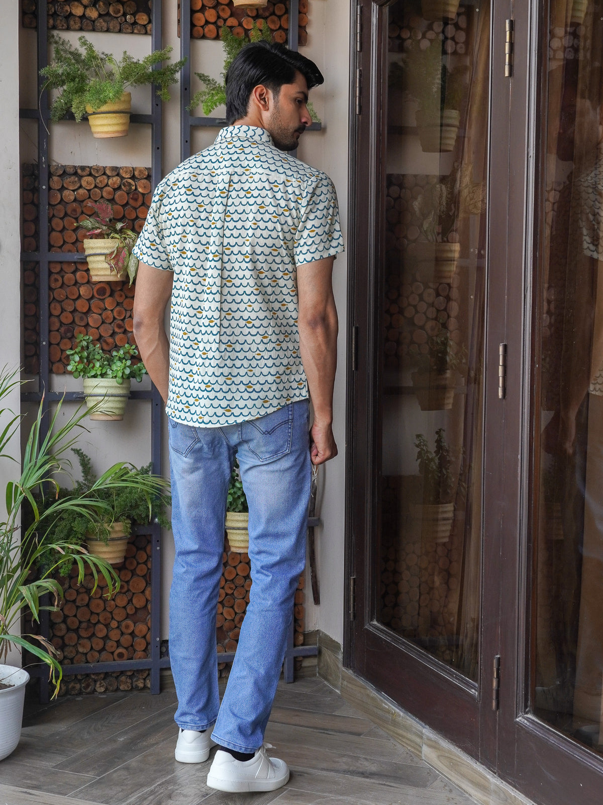 Back view of The Dapper X green floral printed shirt