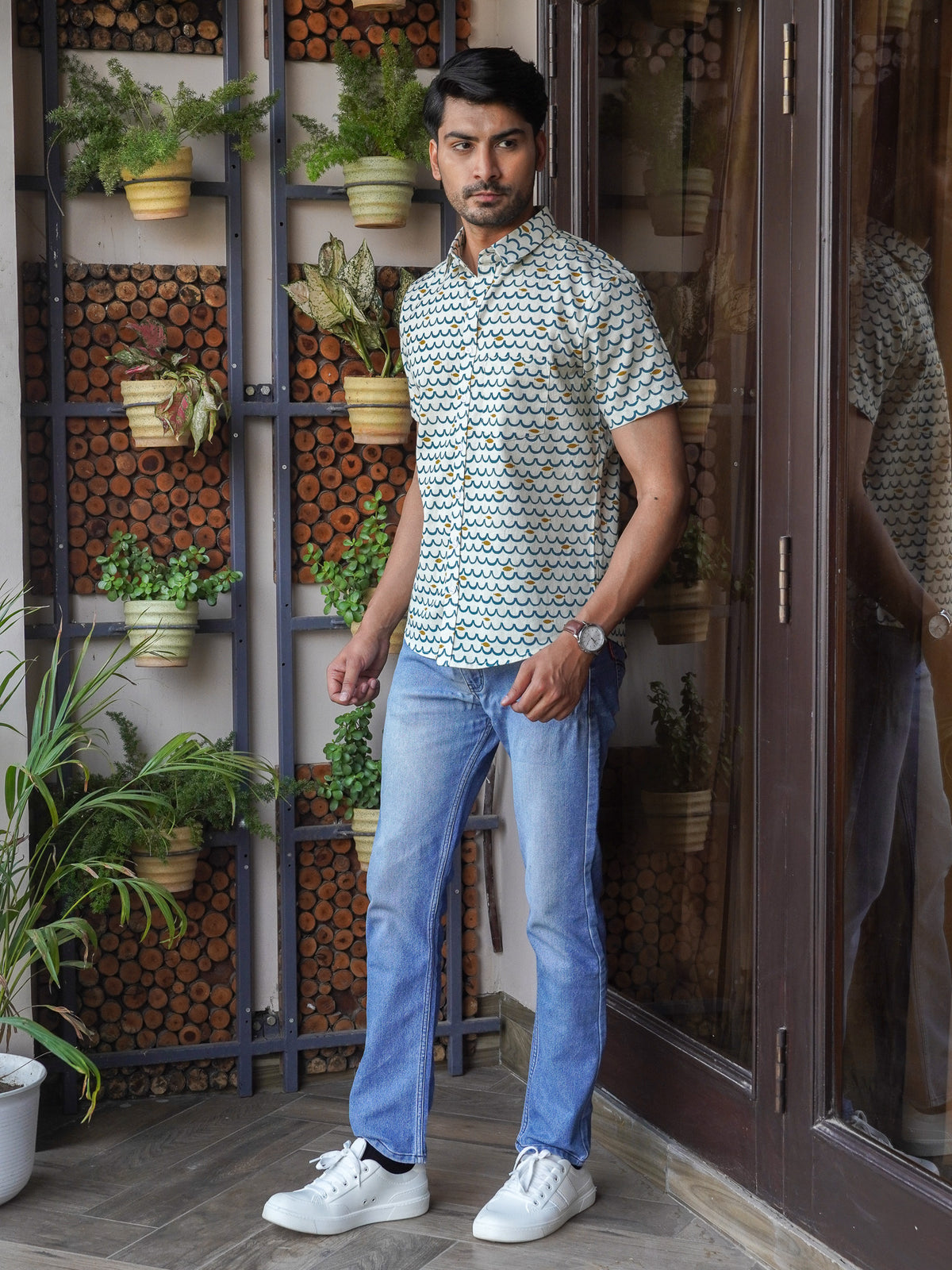 Side view of men’s green half sleeve printed shirt