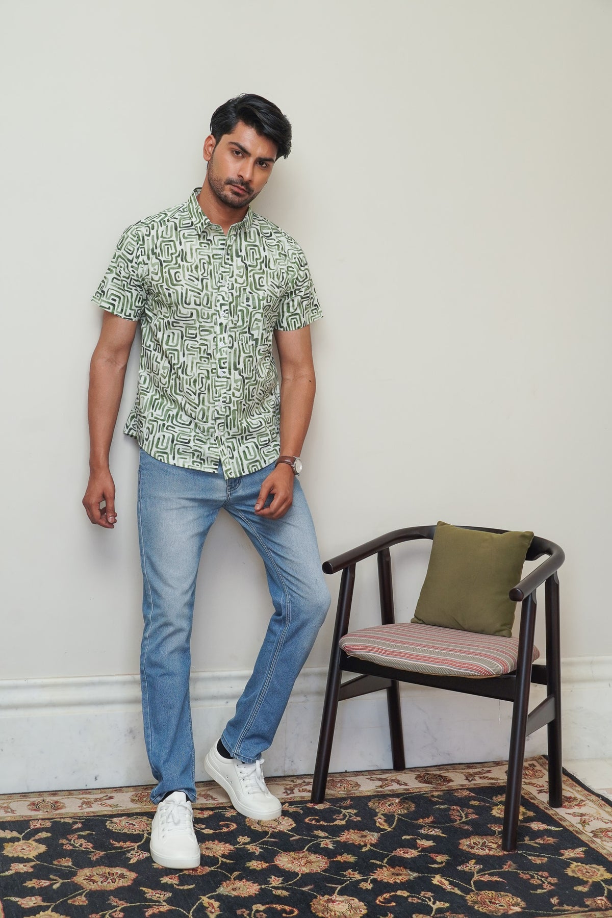 Side view of men’s green abstract half sleeve shirt
