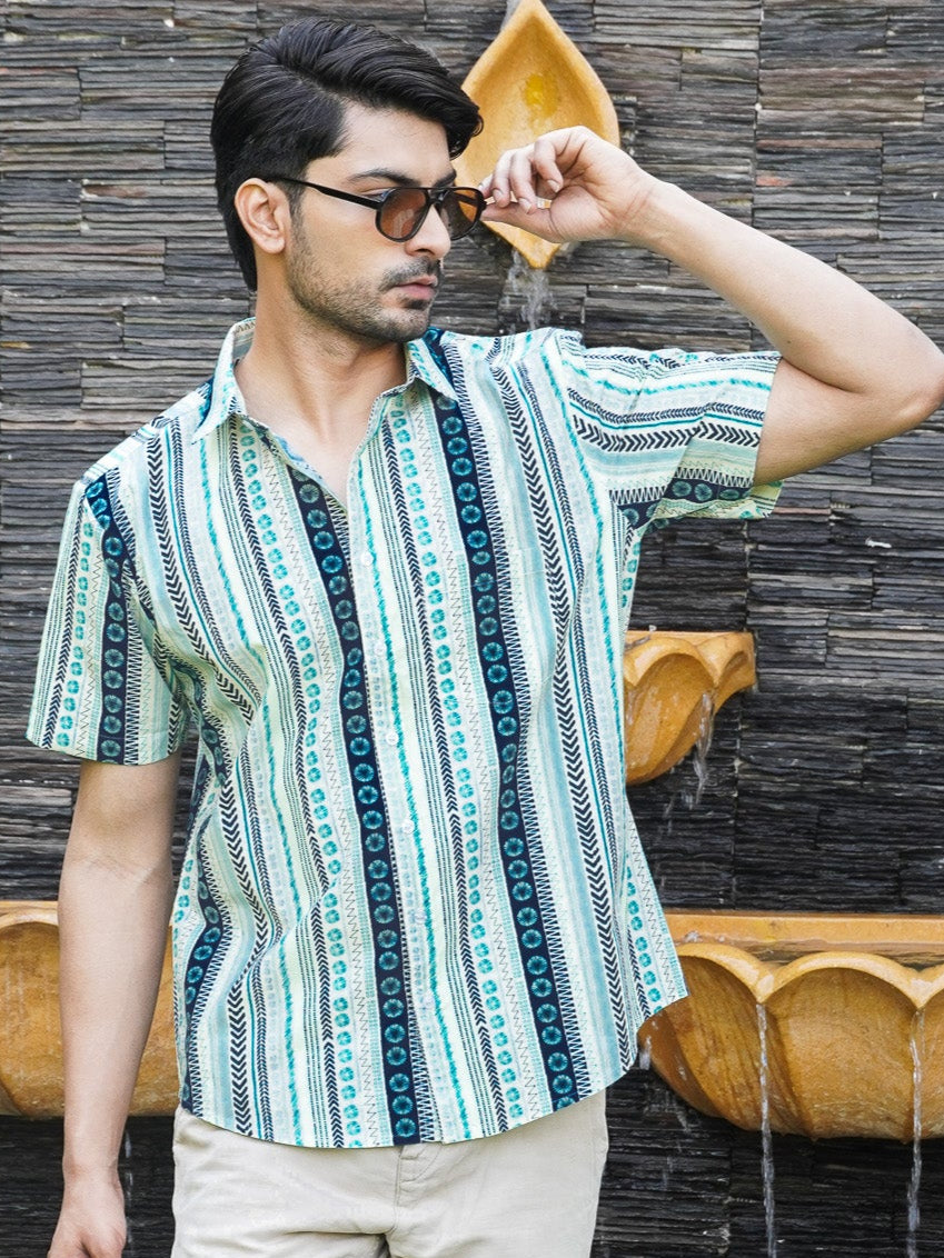 Model wearing a light green dot and stripe printed cotton shirt