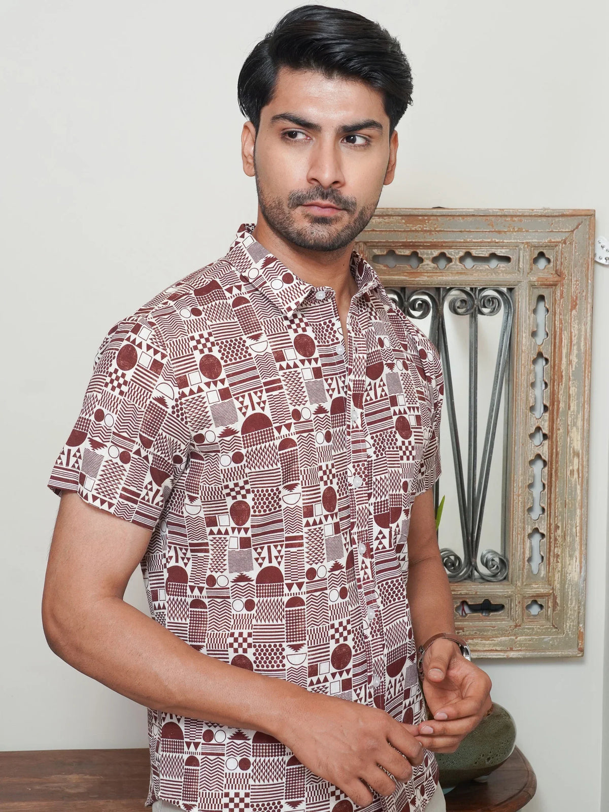 Model wearing a maroon and white geometric printed cotton shirt