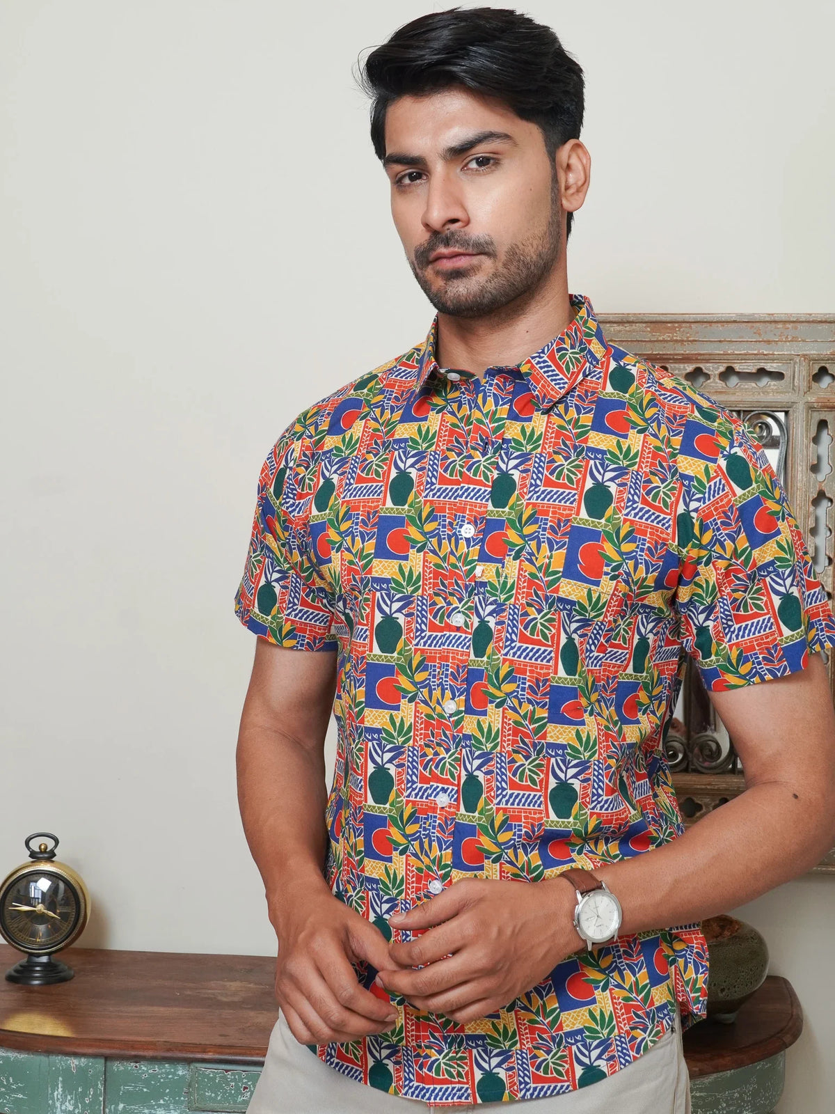 Model wearing a multicolor geometric printed cotton half sleeve shirt