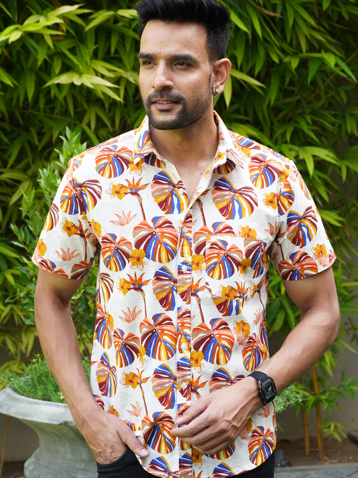 Model wearing a tropical multicolor leaf printed cotton shirt
