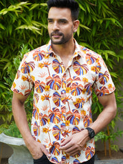Model wearing a tropical multicolor leaf printed cotton shirt