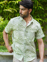 Model wearing a green zigzag printed cotton half sleeve shirt