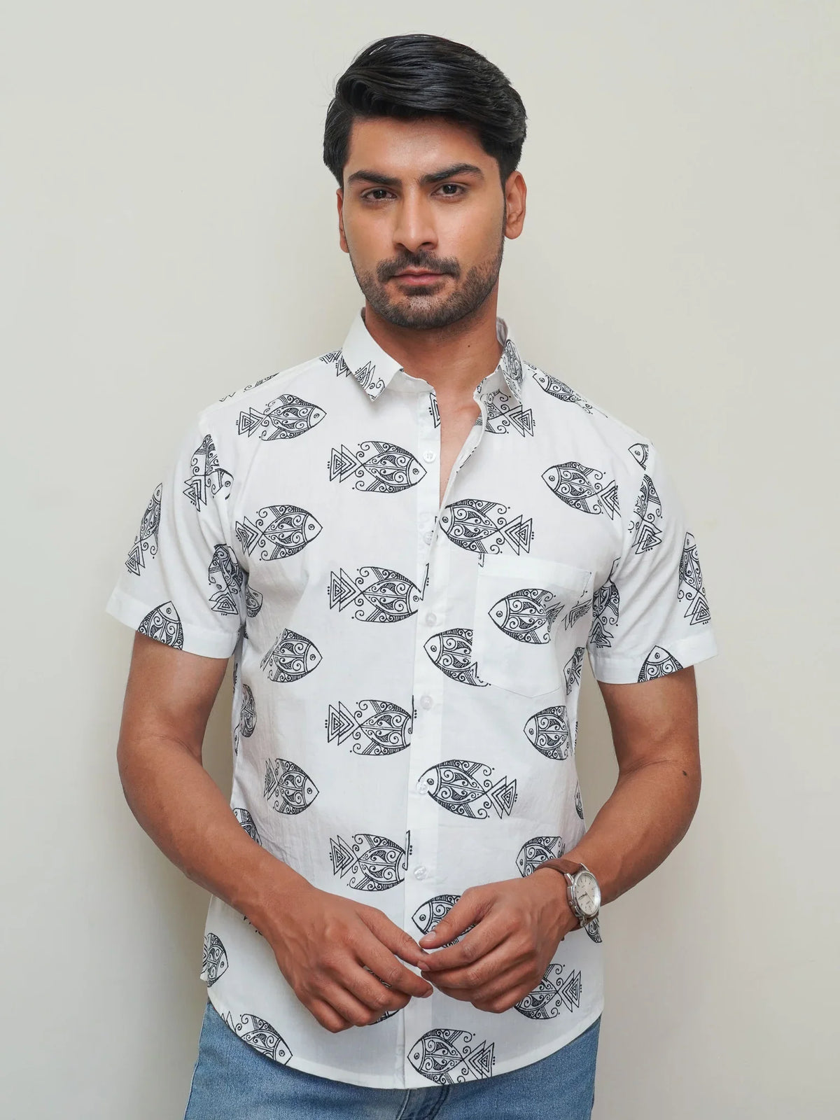 Model wearing a white cotton shirt with bold black fish print