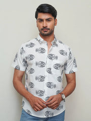 Model wearing a white cotton shirt with bold black fish print