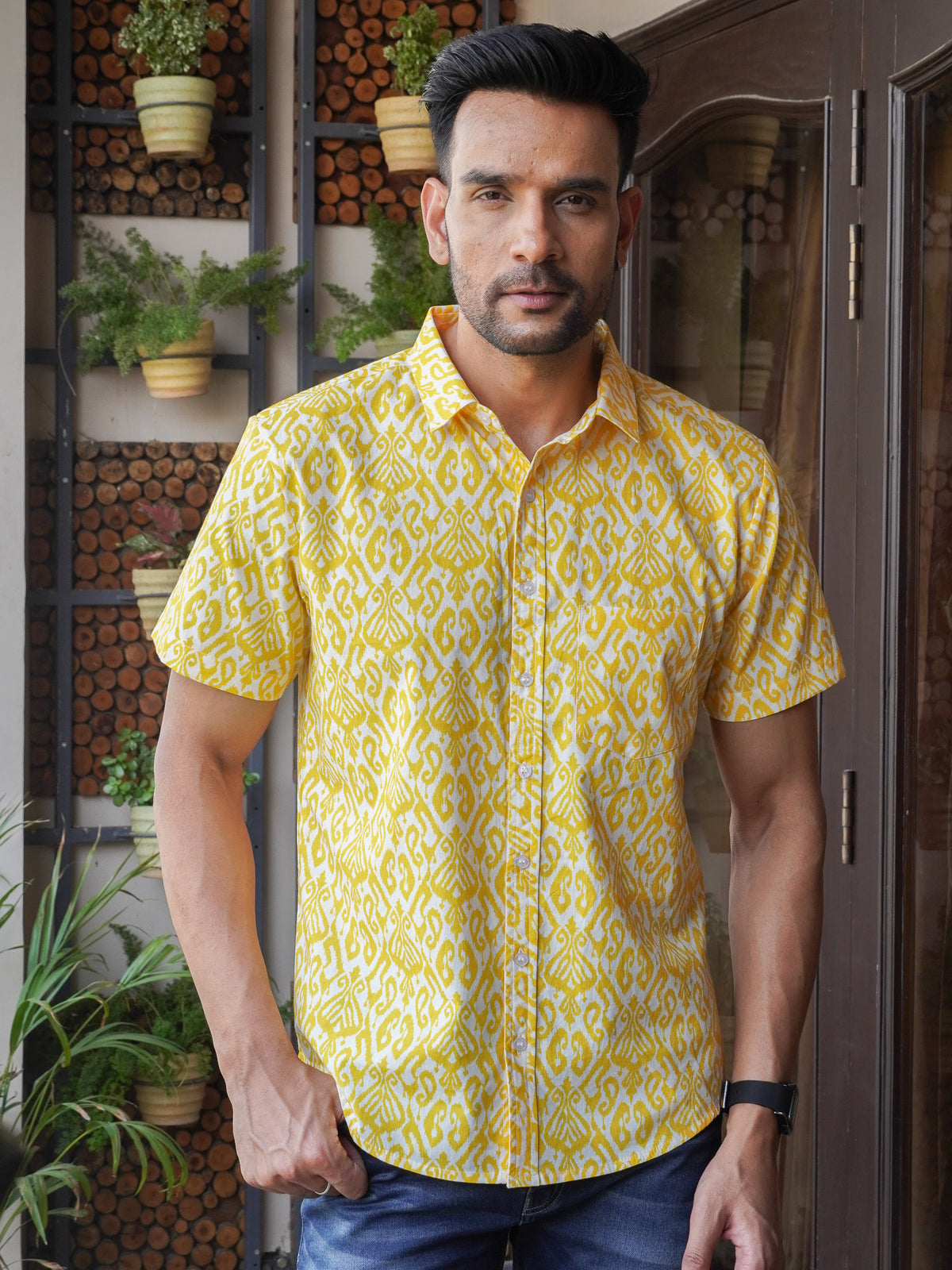 Model wearing a yellow geometric printed cotton half sleeve shirt