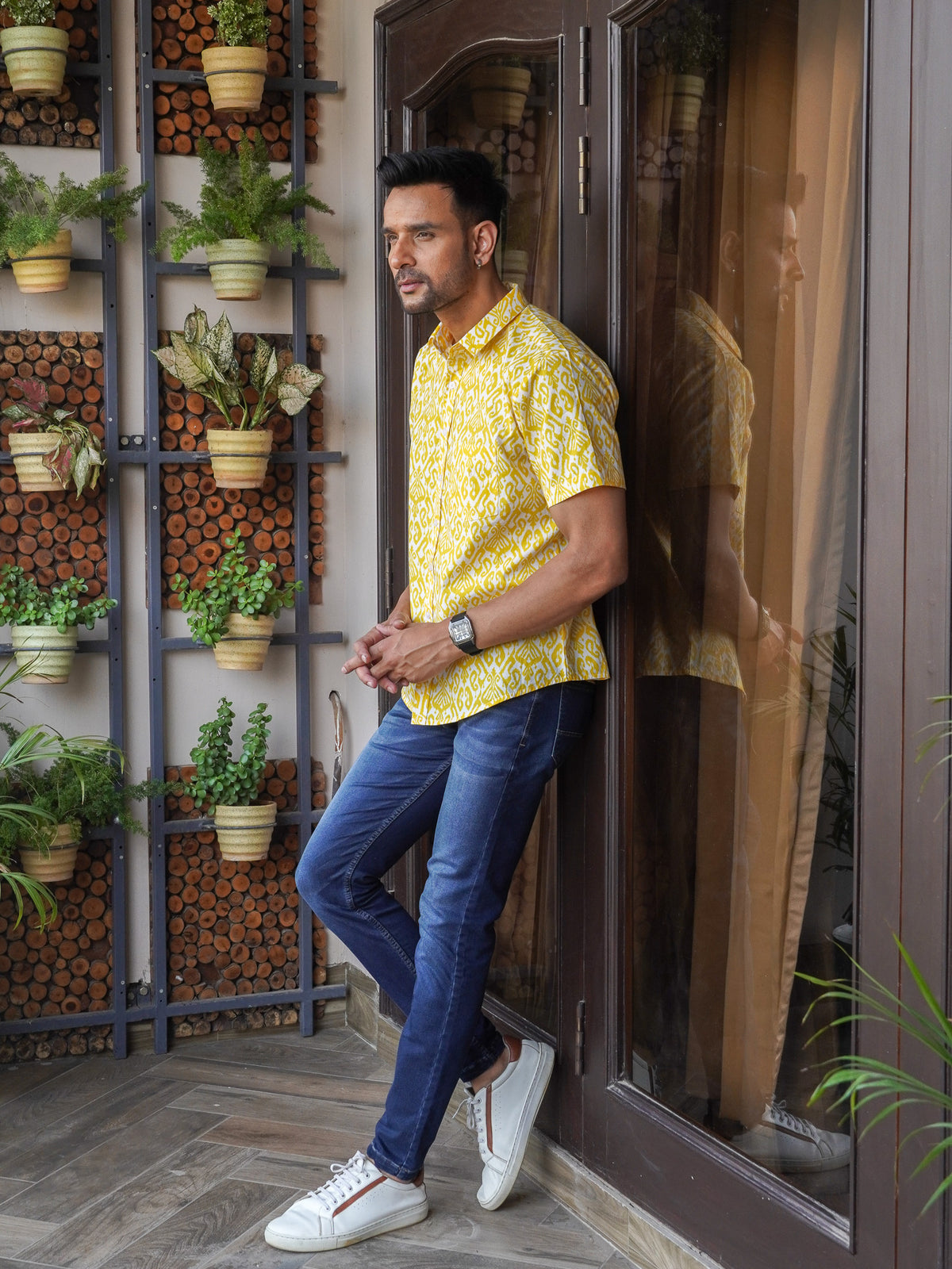 Model wearing a yellow geometric printed cotton half sleeve shirt