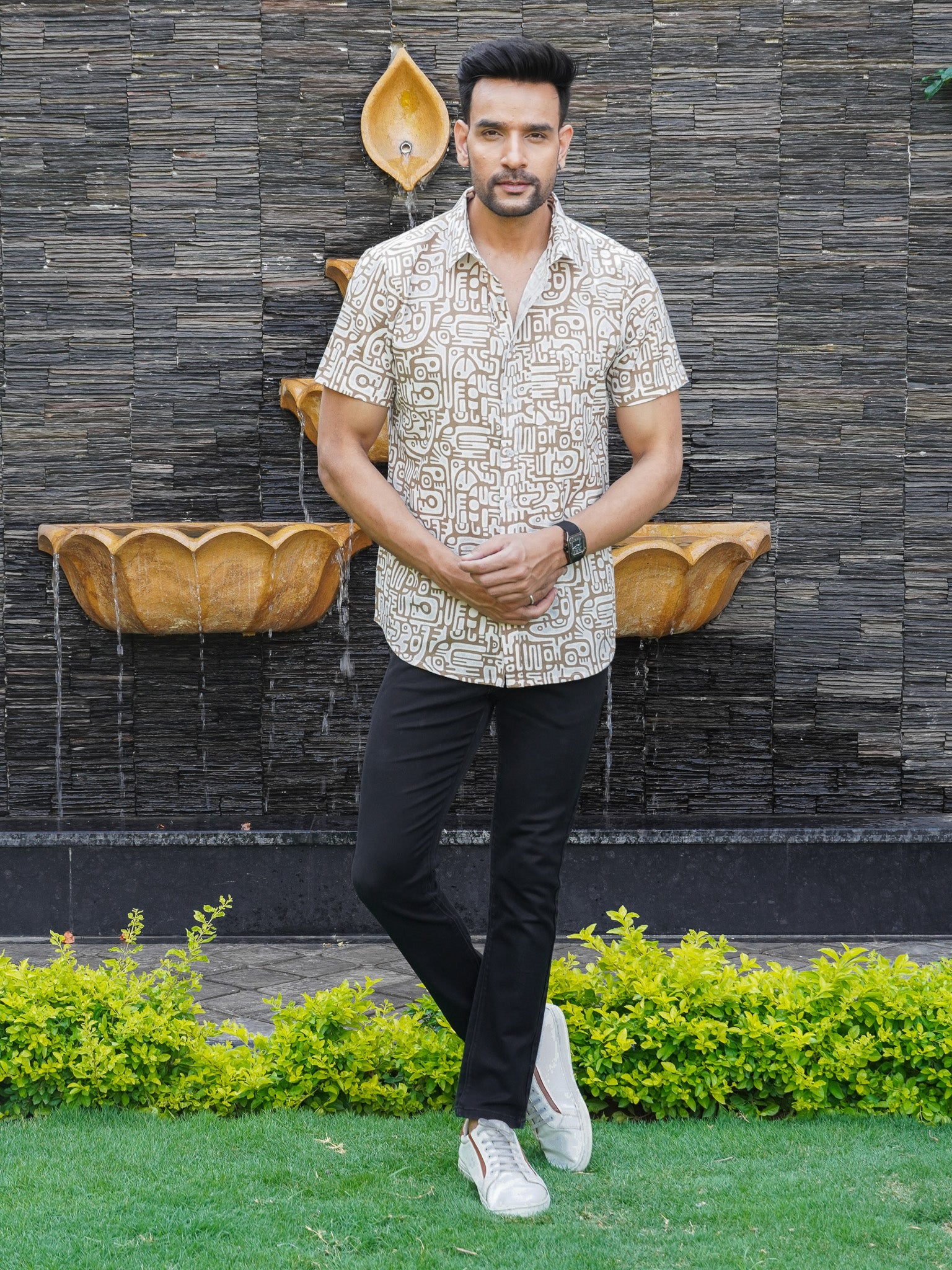 Model wearing men’s beige Urban Tribal print half sleeve shirt